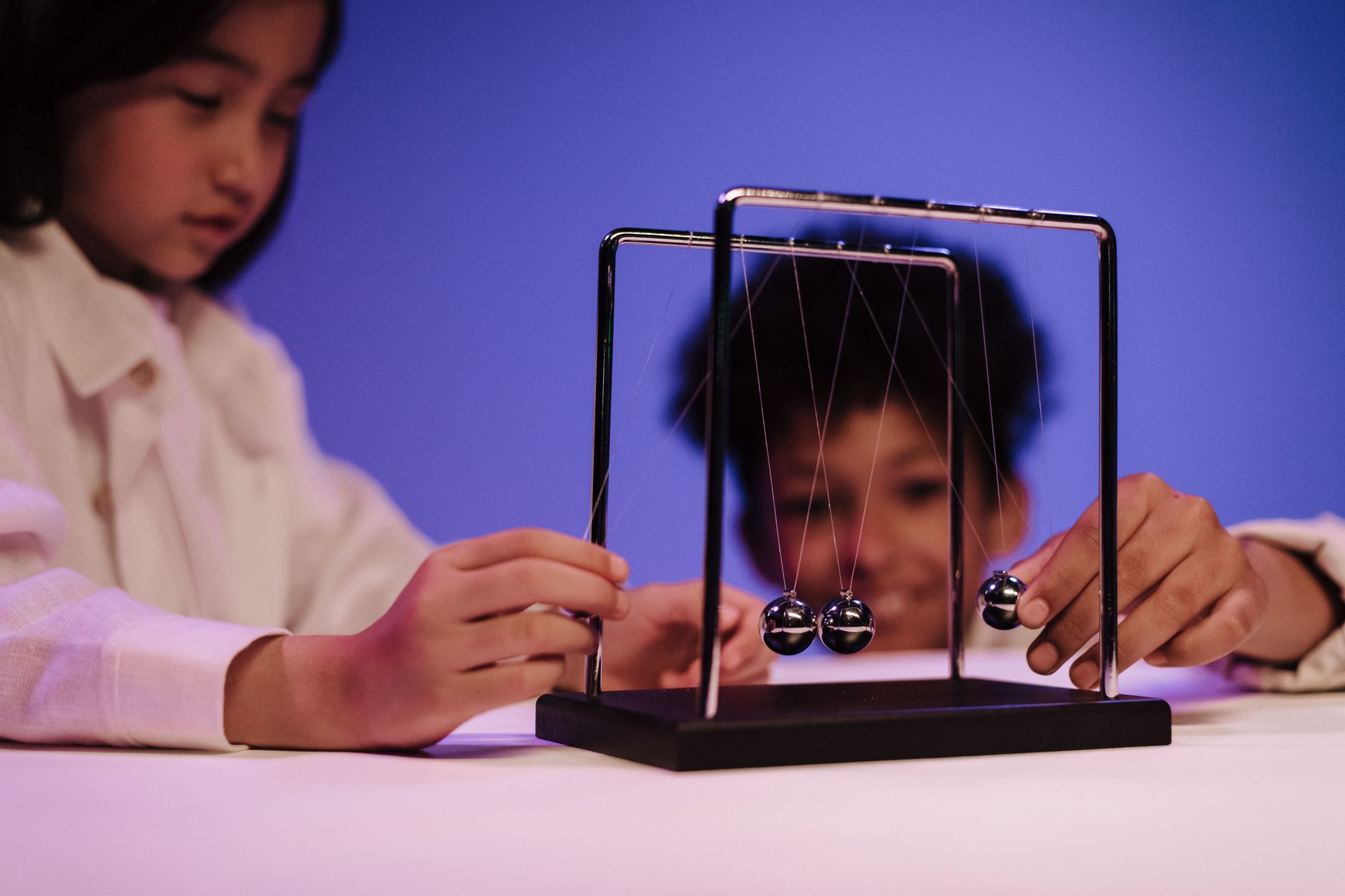 Conservation of Energy: Why Does Newton's Cradle Keep Swinging?