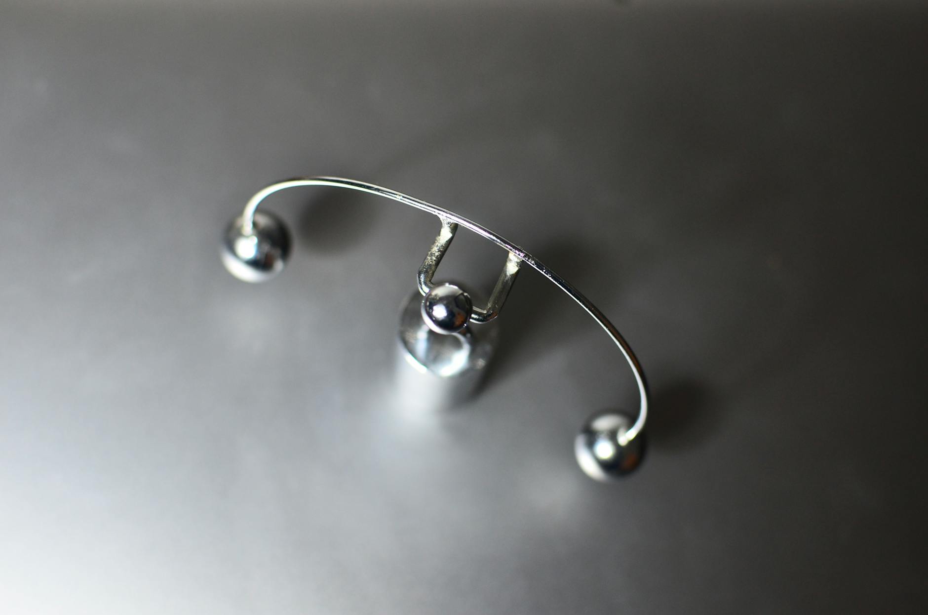 How Does Newton's Cradle Work? Physics of Pendulum Balls